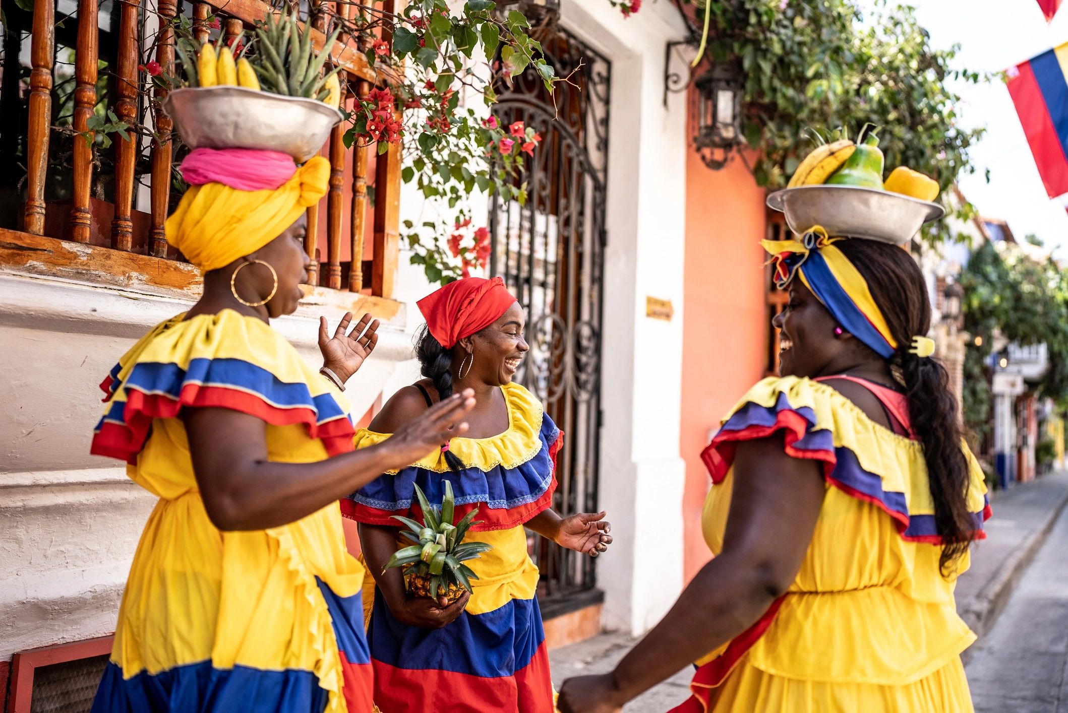 Palenqueras having fun while talking on the street in Cartagena, Colombia
