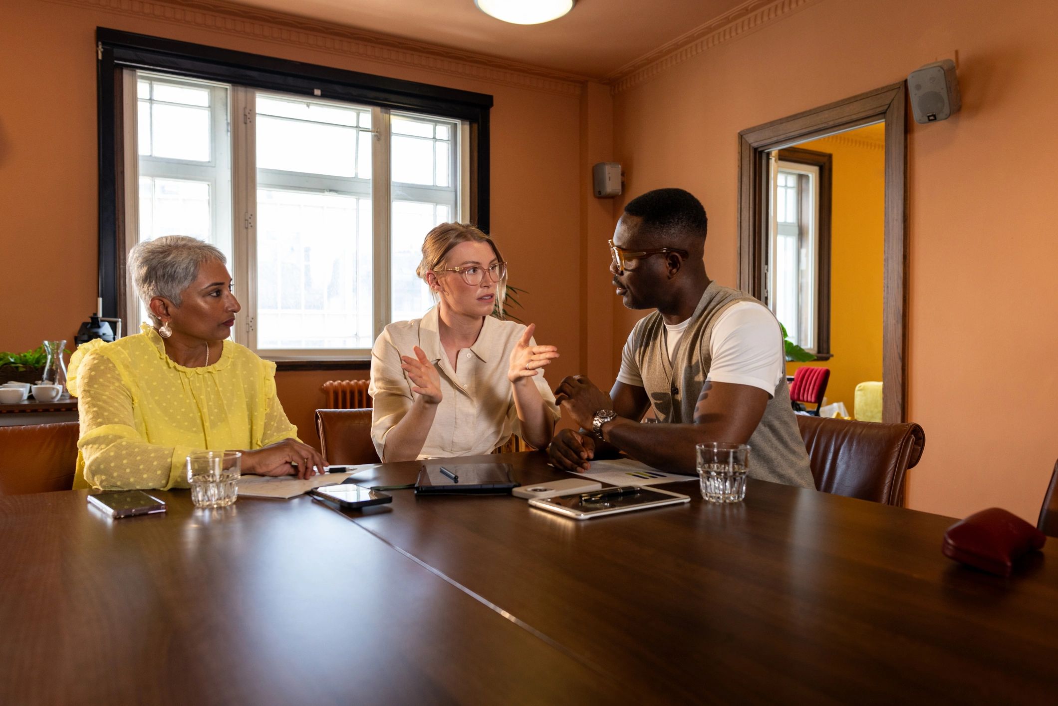 Team in discussion around a conference table