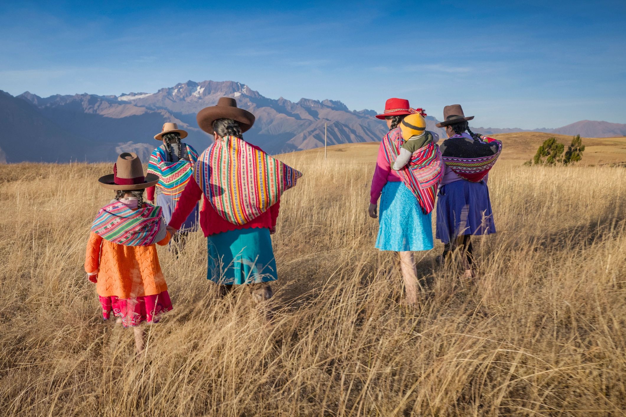 Women in traditional dress representing cultural continuity and craft traditions