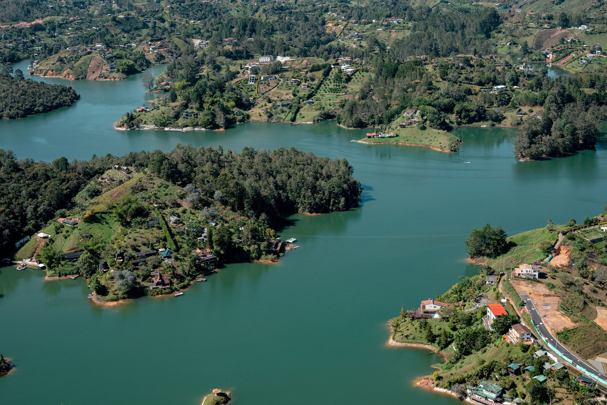 Guatapé reservoir emerald water and green islands aerial view